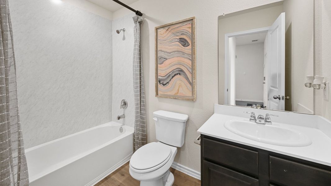 Representative furnished interior of a home built from the Zavalla by D.R. Horton in Oak Valley Estates, Bullard (Image 12).