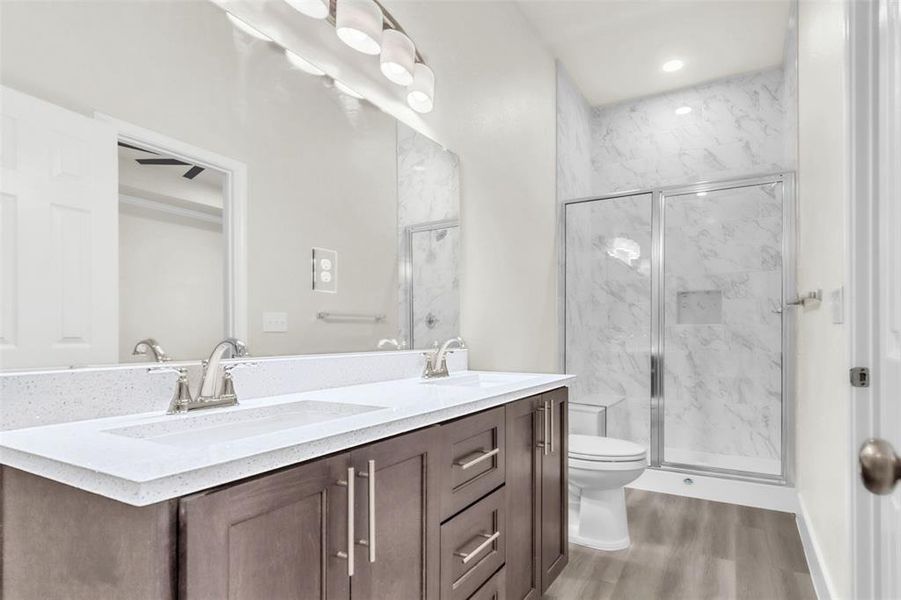 Primary bath features stunning quartz double vanity