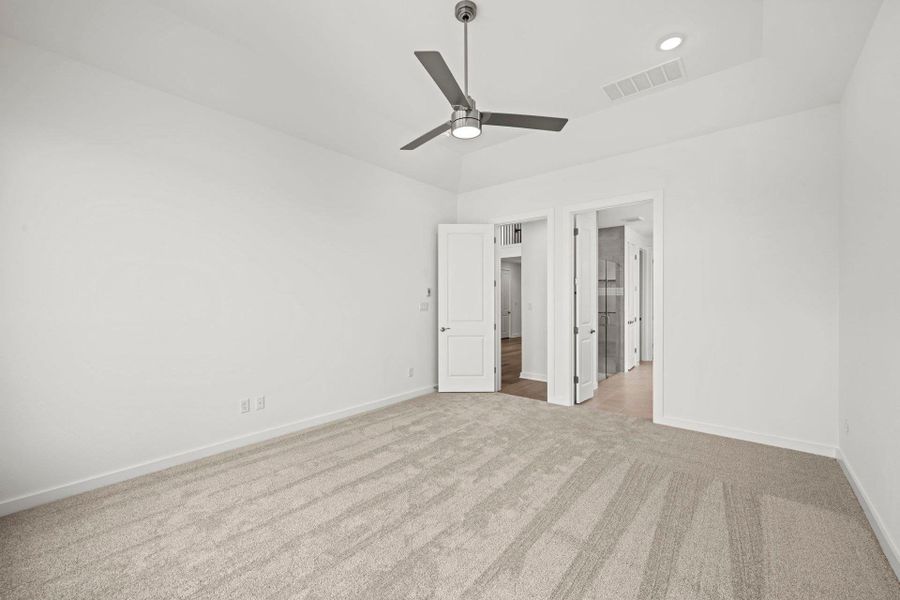 Primary Bedroom with elevated ceiling