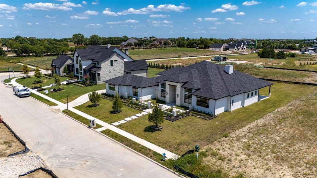Front exterior of a new home in , Heath, TX, highlighting curb appeal (Image 25).