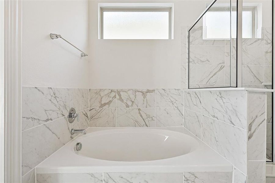 Bathroom with tiled tub