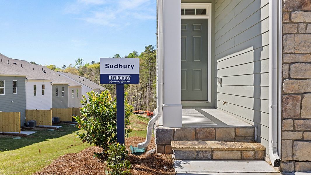 Representative exterior photo of a completed home built from the SUDBURY 24' TOWNHOME by D.R. Horton in Mountain Park, Dahlonega, GA (Image 18). Representative exterior photo of a completed home built from the SUDBURY 24' TOWNHOME by D.R. Horton in Mountain Park, Dahlonega, GA (Image 18).