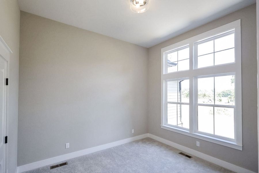 Spacious, unfurnished interior of a new home in Baker Road, Birchwood (Image 44).