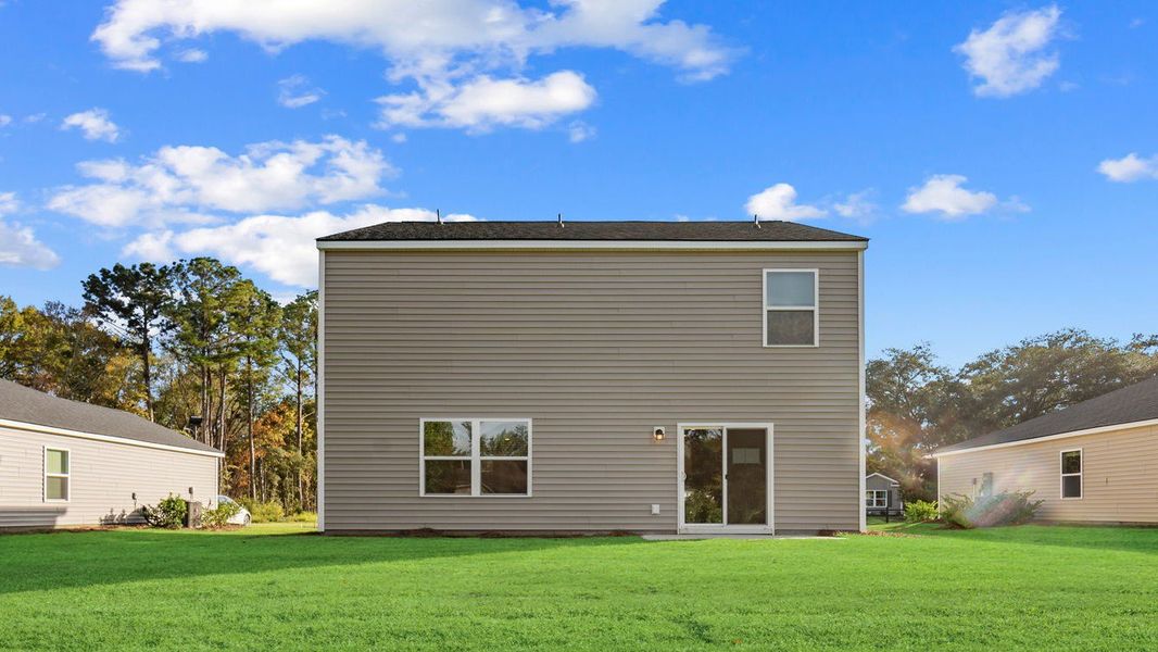 Exterior details and patio area of a home in The Groves at Bees Creek, Ridgeland (Image 2).