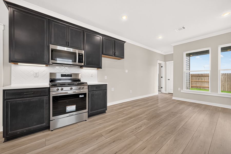 Furnished interior view inside a new home in Aldeana, Bonney (Image 10).