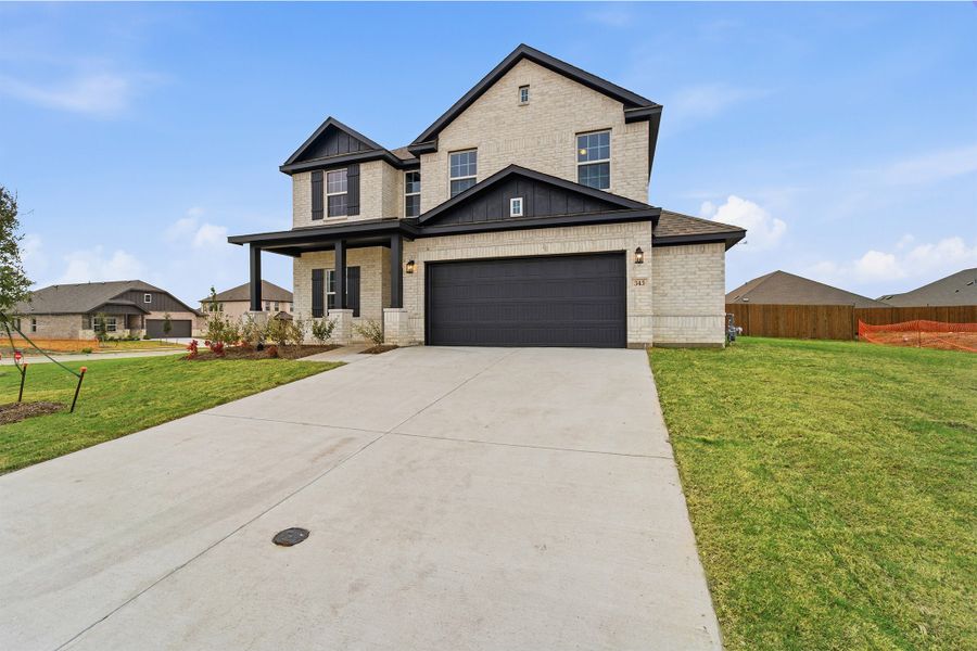 Front exterior of a new home in Saddlebrook Estates, Waxahachie, TX, highlighting curb appeal (Image 19).