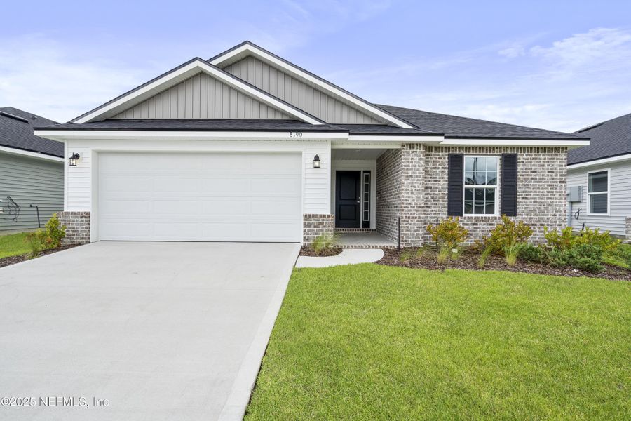 Front exterior of a new home in Summerglen, Jacksonville, FL, highlighting curb appeal (Image 14). Front exterior of a new home in Summerglen, Jacksonville, FL, highlighting curb appeal (Image 14).