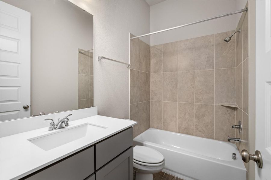 Third full bathroom with tub/shower combo and modern vanity for secondary bedrooms.