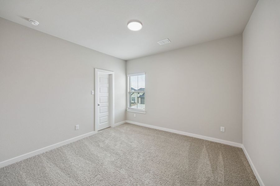 Bedroom in the Stanley II home plan by Trophy Signature Homes – REPRESENTATIVE PHOTO Bedroom in the Stanley II home plan by Trophy Signature Homes – REPRESENTATIVE PHOTO
