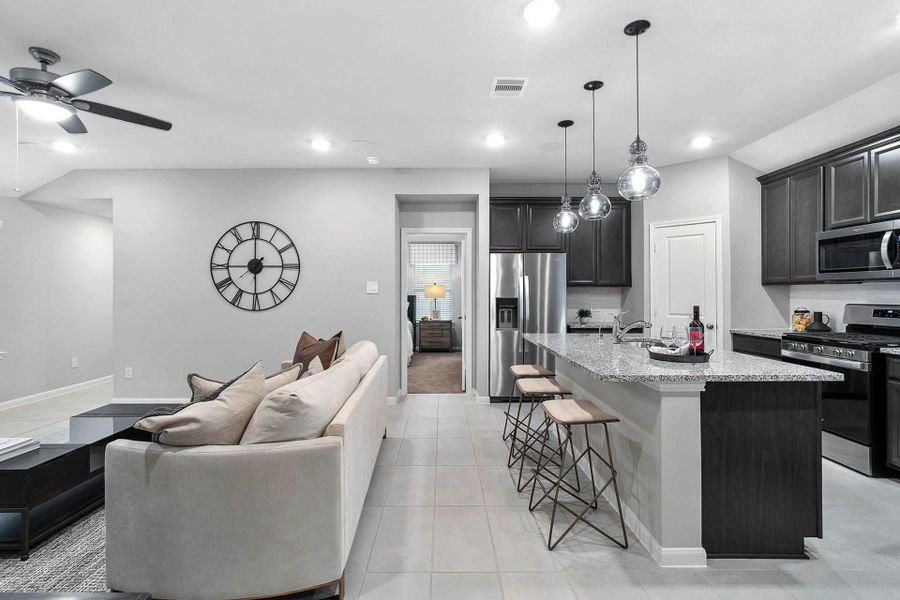 The perfect design for modern living, offering open sightlines from the family room directly to the functional kitchen island, ensuring you're always connected to the conversation while preparing meals.