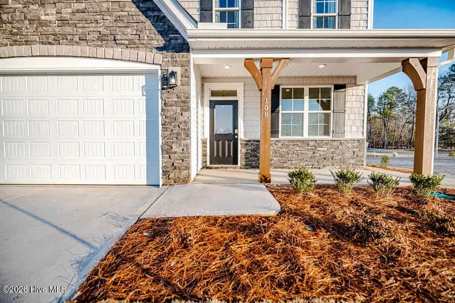 Exterior details and patio area of a home in Terrapin, Leland (Image 3).