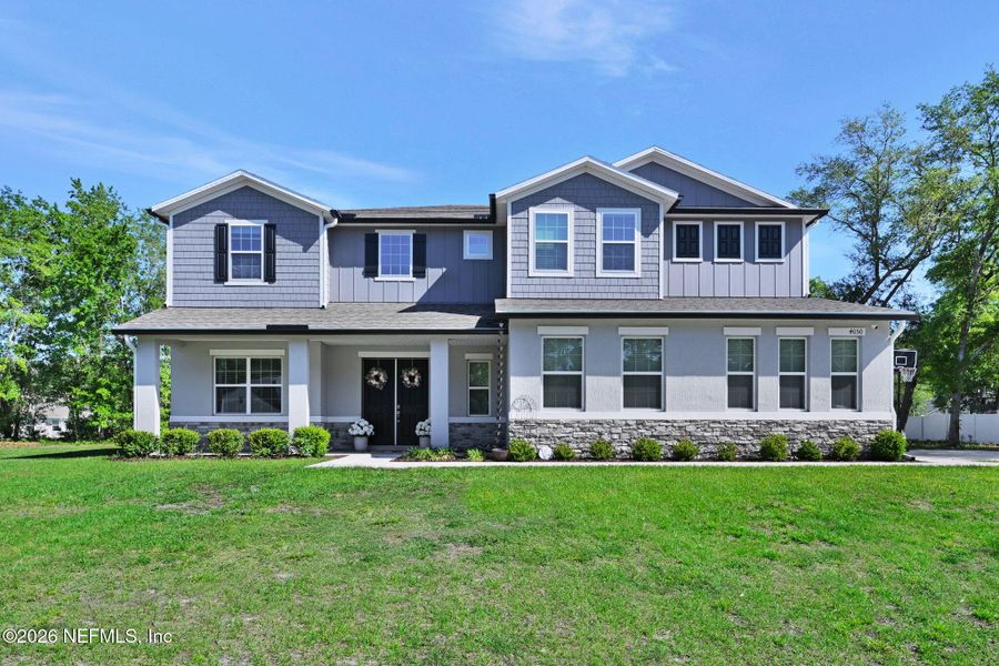 Front exterior of a new home in , Middleburg, FL, highlighting curb appeal (Image 26).