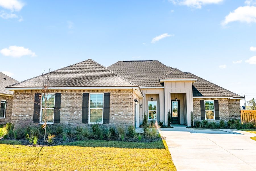 Front exterior of a new home in Natureview, Freeport, FL, highlighting curb appeal (Image 17).