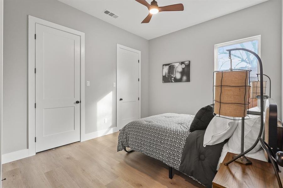 Bedroom featuring ceiling fan and light hardwood / wood-style floors