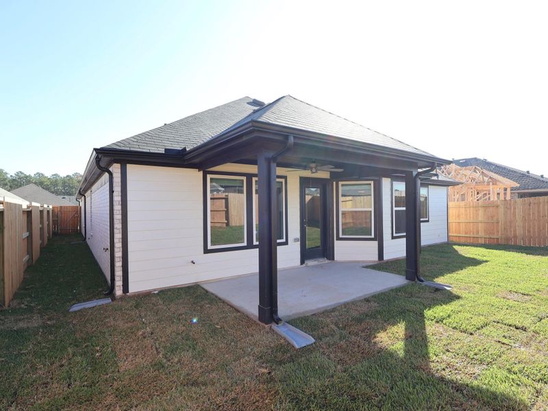 Exterior details and patio area of a home in Magnolia Ridge, Magnolia (Image 25).