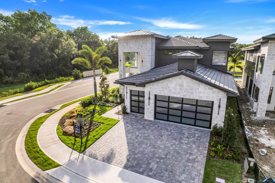 Front exterior of a new home in Hampton Green at Providence, Davenport, FL, highlighting curb appeal (Image 9).