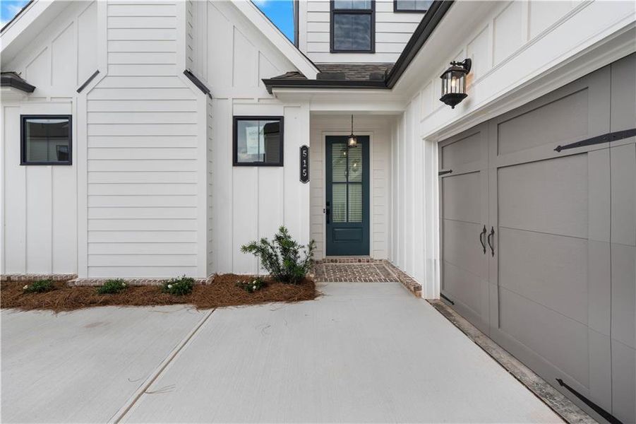 Front exterior of a new home in Promenade at Sawnee Village, Cumming, GA, highlighting curb appeal (Image 24).