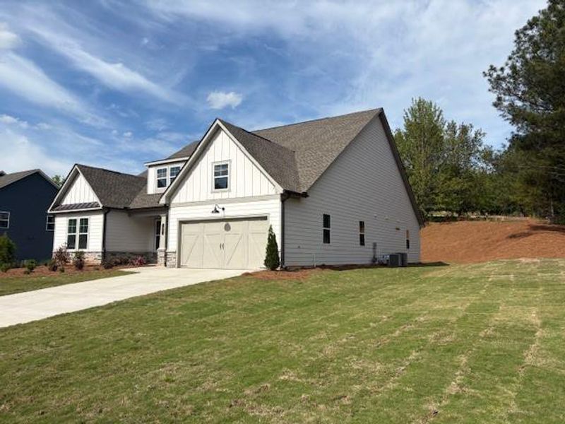 Front exterior of a new home in Wellington Estates, Madison, GA, highlighting curb appeal (Image 2).