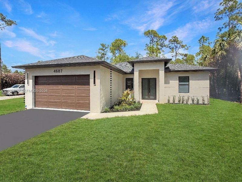 Contemporary stucco exterior with a dark shingle roof, double entry doors, a wood-finish garage door, exterior wall sconces, and a landscaped front yard