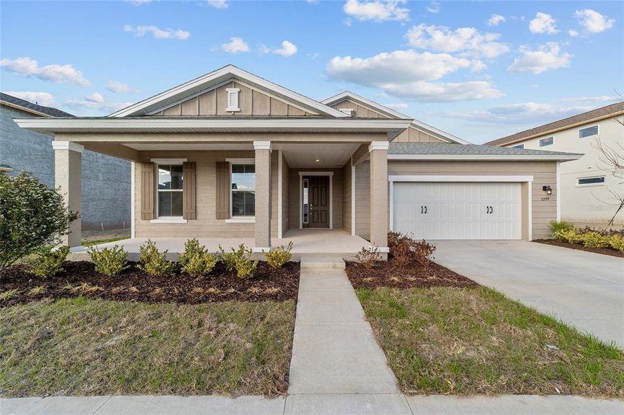 Front exterior of a new home in Calesa Township, Ocala, FL, highlighting curb appeal (Image 21).