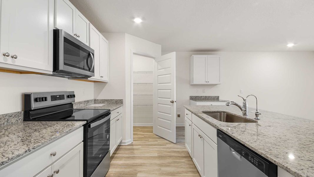 Furnished interior view inside a new home in Ashton Park Phase III, Freeport (Image 5).