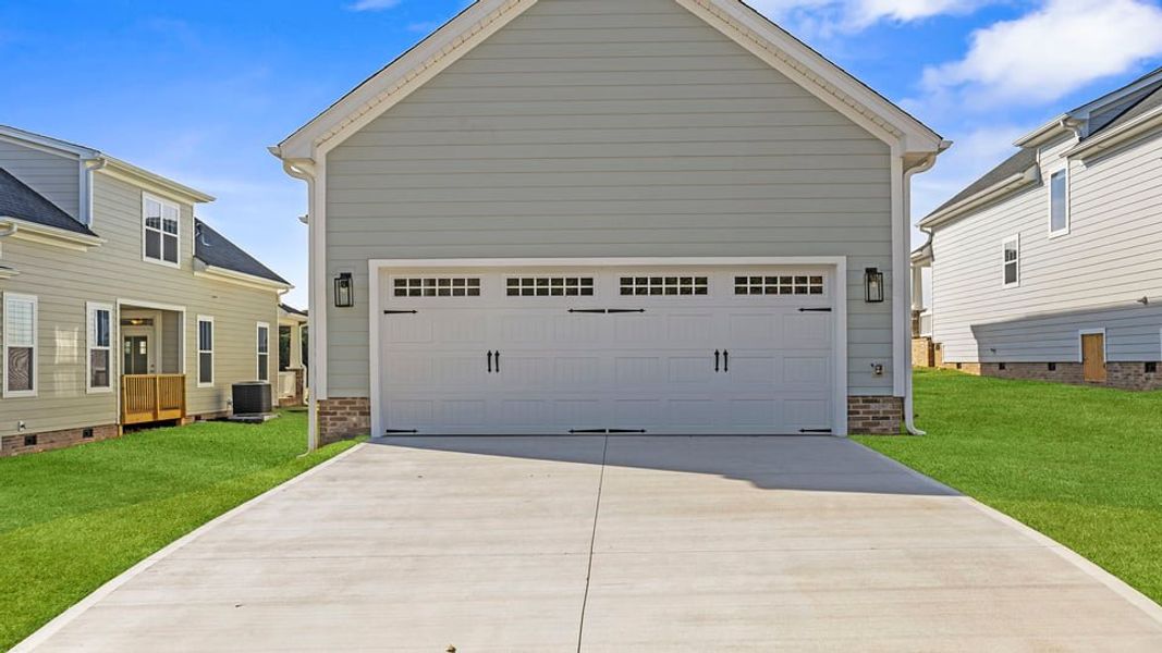 Exterior details and patio area of a home in Sunset Summits, Spartanburg (Image 4).