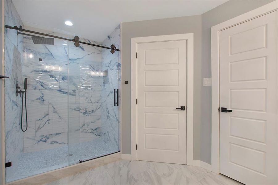 Bathroom with a shower with door