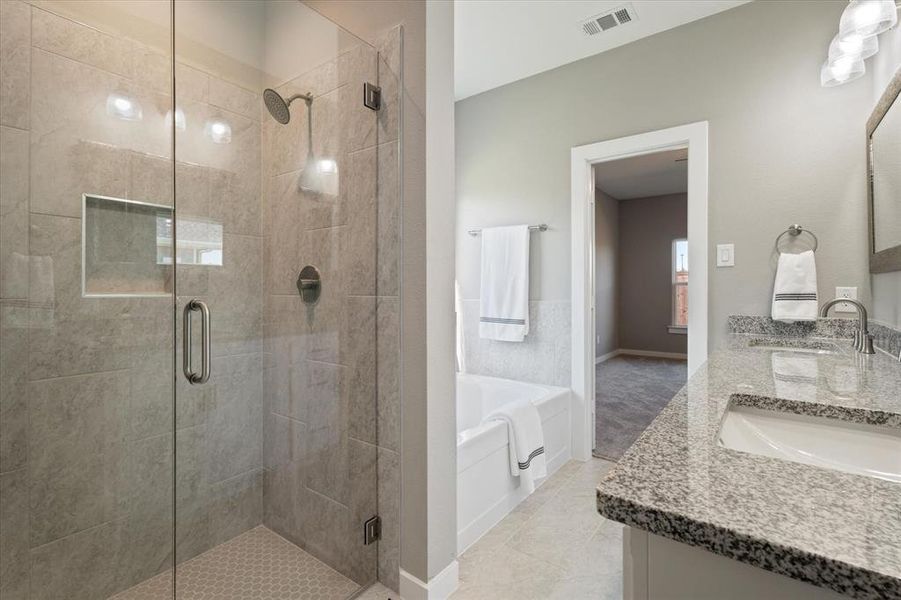 Bathroom with tile patterned floors, vanity, and independent shower and bath Bathroom with tile patterned floors, vanity, and independent shower and bath