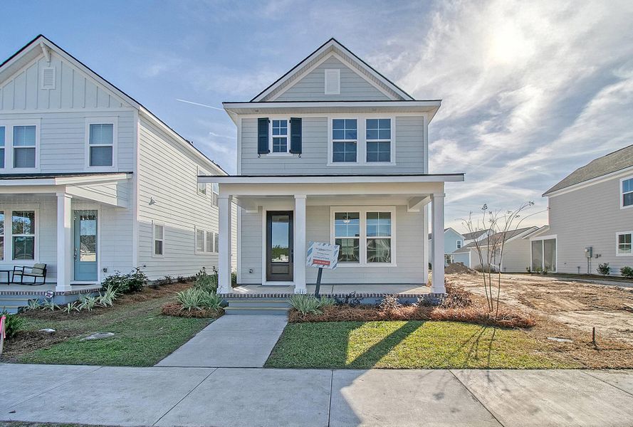Front exterior of a new home in Nexton - Midtown - The Park Collection, Summerville, SC, highlighting curb appeal (Image 16). Front exterior of a new home in Nexton - Midtown - The Park Collection, Summerville, SC, highlighting curb appeal (Image 16).