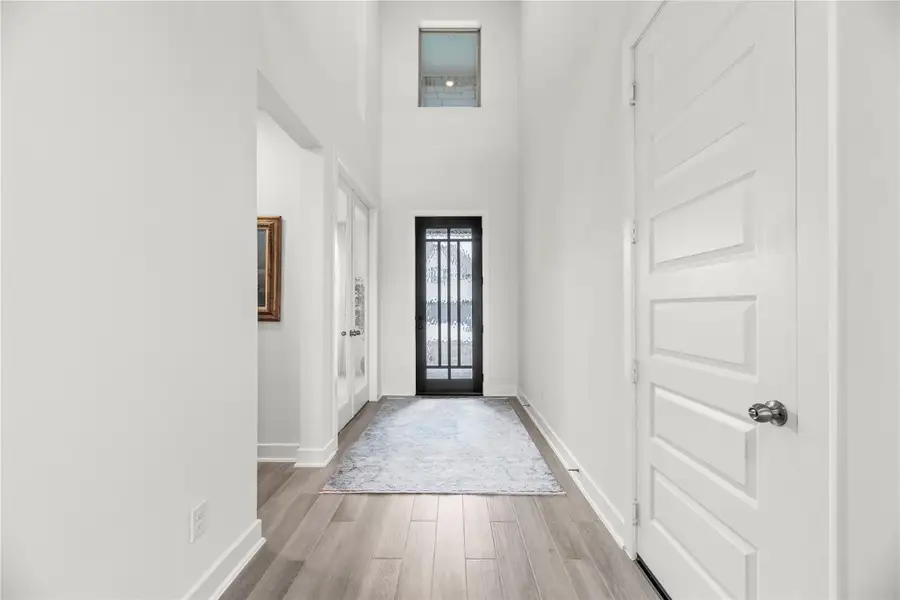 From the front door to the back, this home showcases striking features, elegant finishes, and expansive spaces designed for both comfortable daily living and exceptional entertaining.