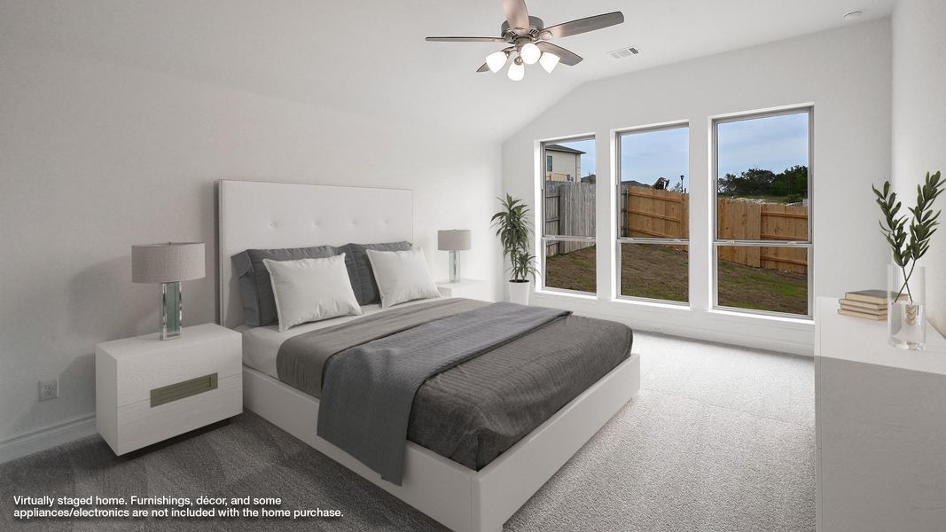 Bedroom featuring carpet flooring, lofted ceiling, and ceiling fan