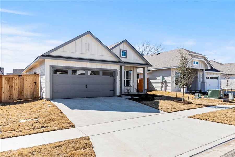 Front exterior of a new home in Trace, San Marcos, TX, highlighting curb appeal (Image 2). Front exterior of a new home in Trace, San Marcos, TX, highlighting curb appeal (Image 2).