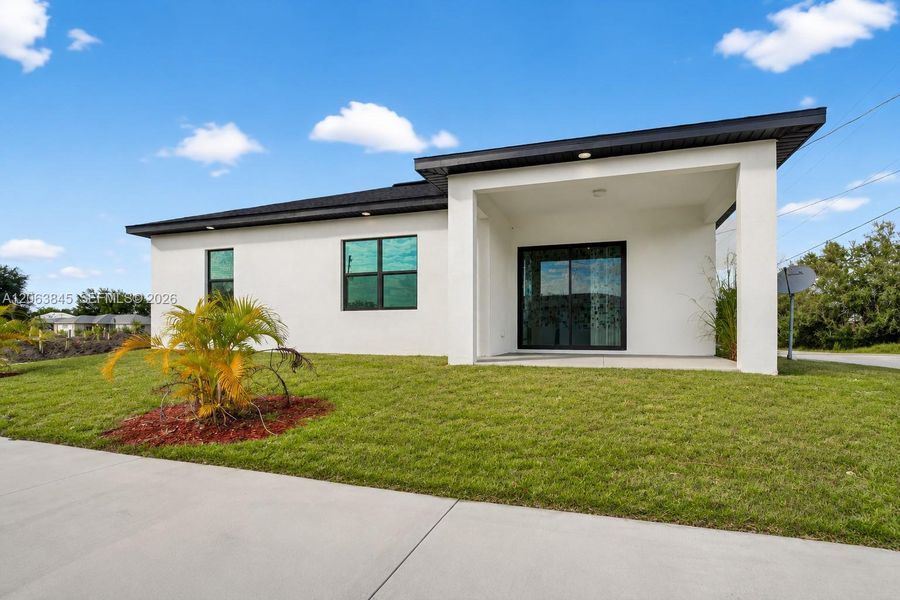 Exterior details and patio area of a home in , Lehigh Acres (Image 3).