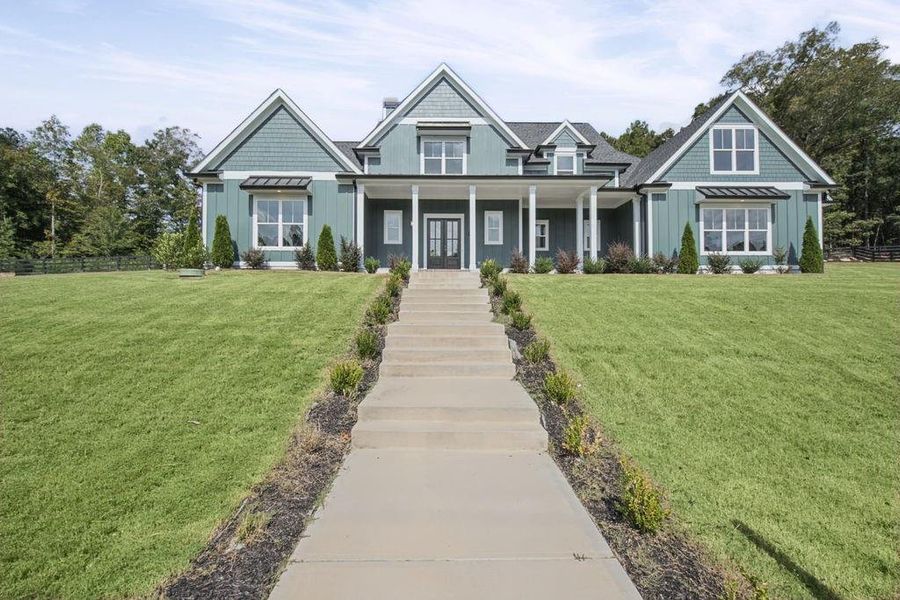 Front exterior of a new home in , Dacula, GA, highlighting curb appeal (Image 32). Front exterior of a new home in , Dacula, GA, highlighting curb appeal (Image 32).