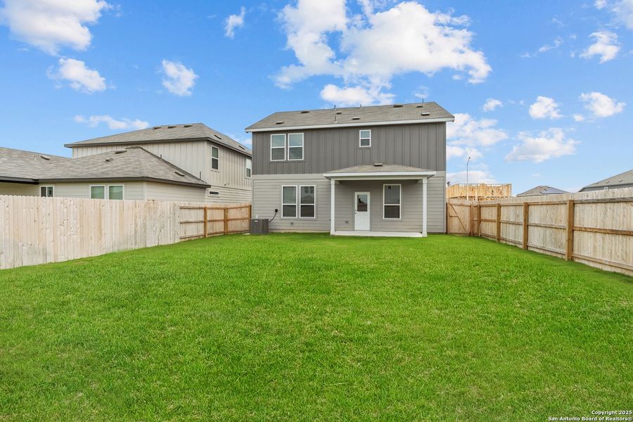 Front exterior of a new home in Lily Springs, Seguin, TX, highlighting curb appeal (Image 1). Front exterior of a new home in Lily Springs, Seguin, TX, highlighting curb appeal (Image 1).
