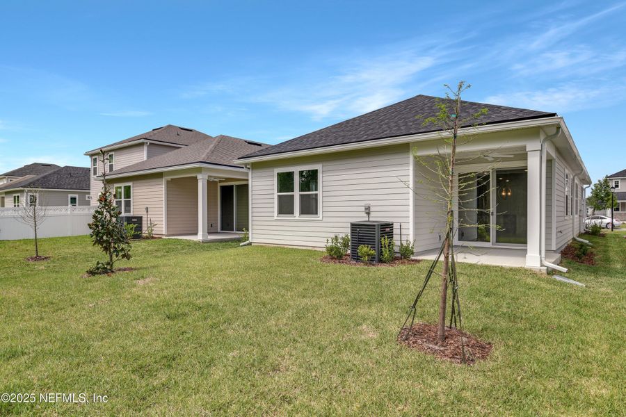Front exterior of a new home in Elm Creek at Silverleaf, St. Augustine, FL, highlighting curb appeal (Image 13). Front exterior of a new home in Elm Creek at Silverleaf, St. Augustine, FL, highlighting curb appeal (Image 13).