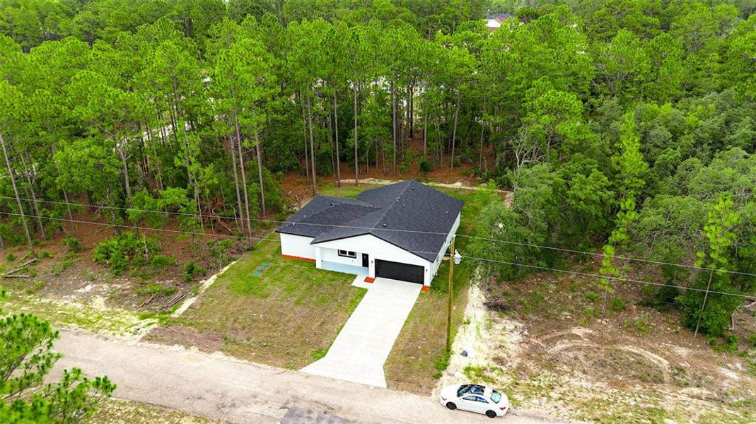 Front exterior of a new home in , Citrus Springs, FL, highlighting curb appeal (Image 24). Front exterior of a new home in , Citrus Springs, FL, highlighting curb appeal (Image 24).
