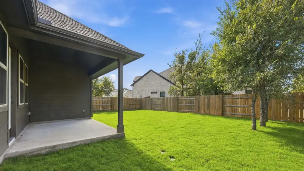 Exterior details and patio area of a home in Oaks at San Gabriel, Georgetown (Image 3).