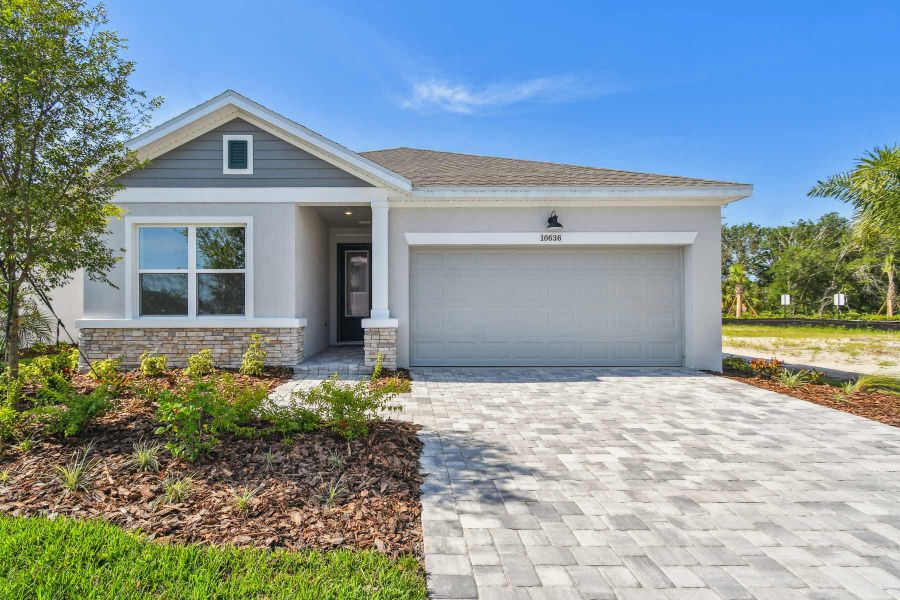 Representative exterior photo of a completed home built from the The Sanborn by David Weekley Homes in North River Ranch – Garden Series, Parrish, FL (Image 10). Representative exterior photo of a completed home built from the The Sanborn by David Weekley Homes in North River Ranch – Garden Series, Parrish, FL (Image 10).