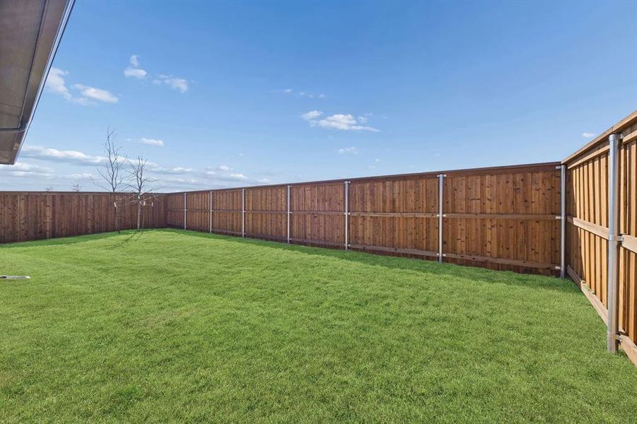 Covered Patio in the Wimbledon home plan by Trophy Signature Homes – REPRESENTATIVE PHOTO