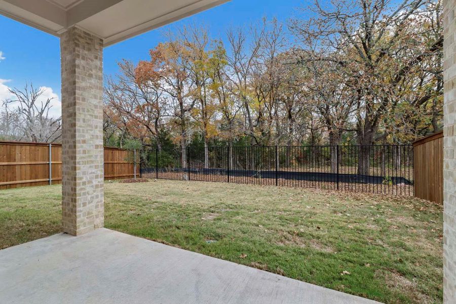 Fenced backyard with a patio Fenced backyard with a patio