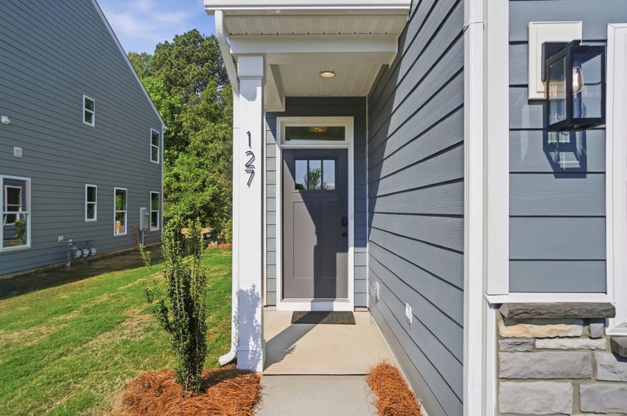 Exterior details and patio area of a home in Blythe Mill Townhomes, Waxhaw (Image 3).