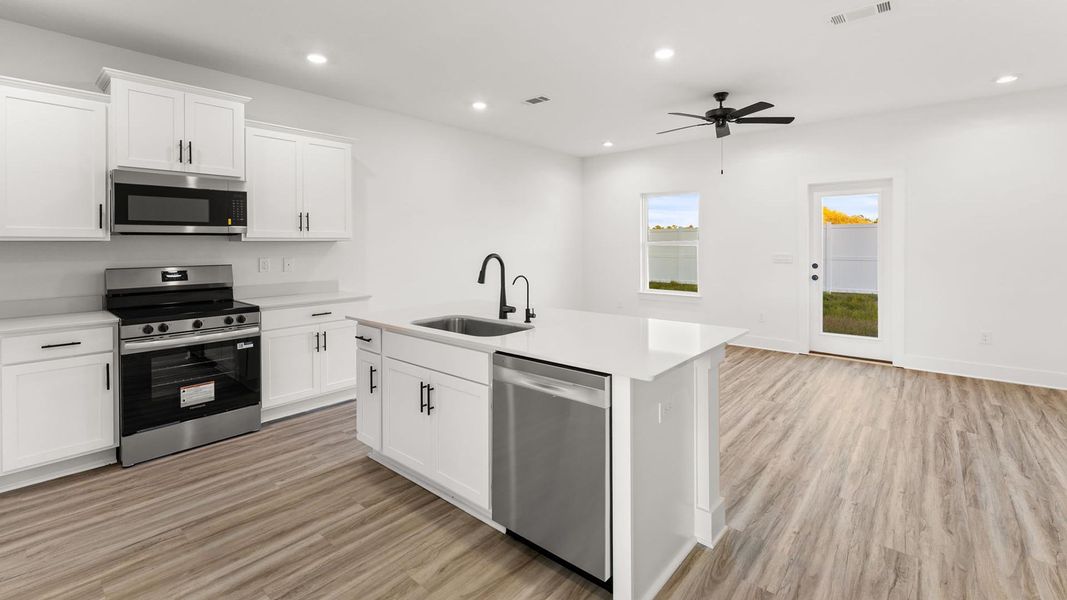 Furnished interior view inside a new home in Colonial East Townhomes, Panama City Beach (Image 4).