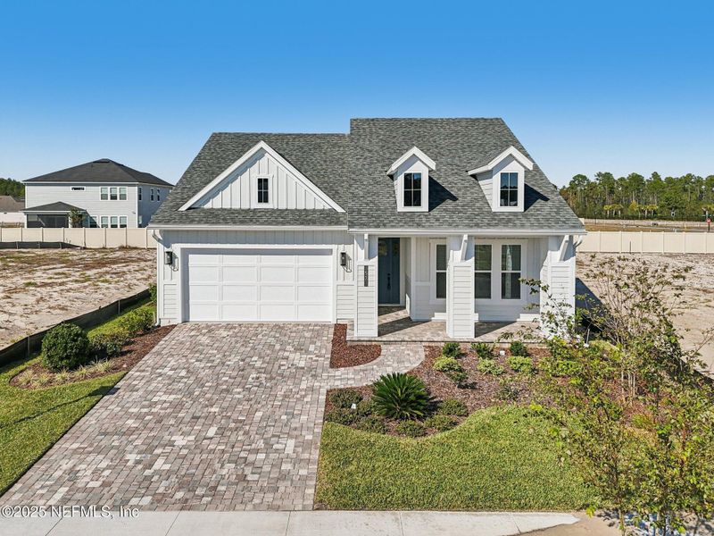 Front exterior of a new home in Seabrook Village II, Ponte Vedra, FL, highlighting curb appeal (Image 32). Front exterior of a new home in Seabrook Village II, Ponte Vedra, FL, highlighting curb appeal (Image 32).