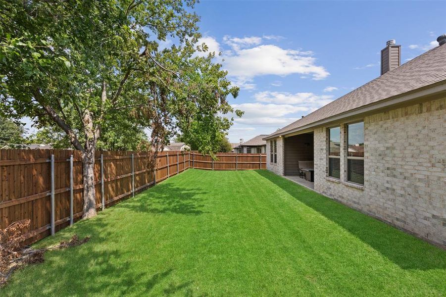 Exterior details and patio area of a home in Willow Vista Estates, Saginaw (Image 3).