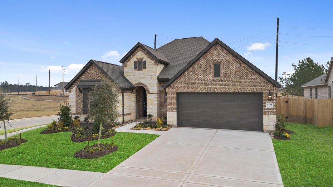 Front exterior of a new home in Escondido, Magnolia, TX, highlighting curb appeal (Image 1). Front exterior of a new home in Escondido, Magnolia, TX, highlighting curb appeal (Image 1).