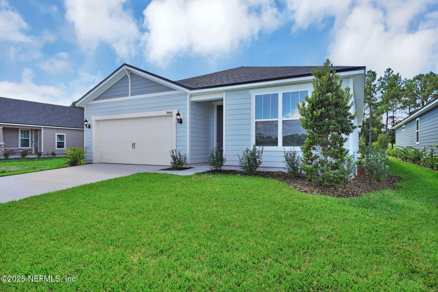 Front exterior of a new home in Hyland Trail, Green Cove Springs, FL, highlighting curb appeal (Image 15).