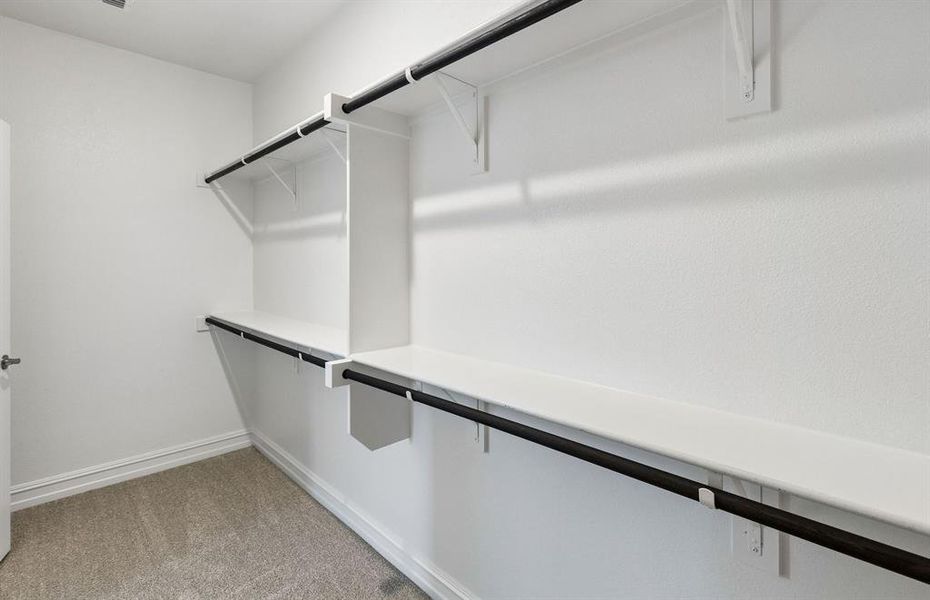Walk-in closet in primary suite