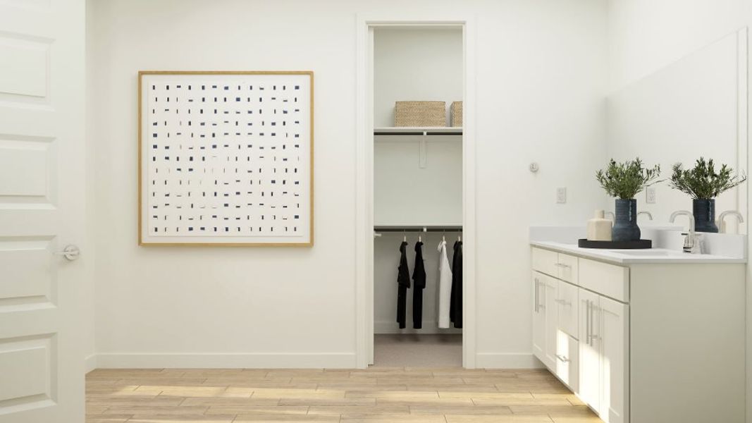 Owner's walk in closet entrance through the bathroom