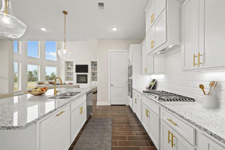 Virtually Staged: Host your next dinner party with confidence! This masterfully-equipped kitchen features a large kitchen island, an abundance of new cabinetry and hardware, TONS of counter space, granite countertops, under cabinet lighting, a walk-in pantry, and stainless-steel appliances.